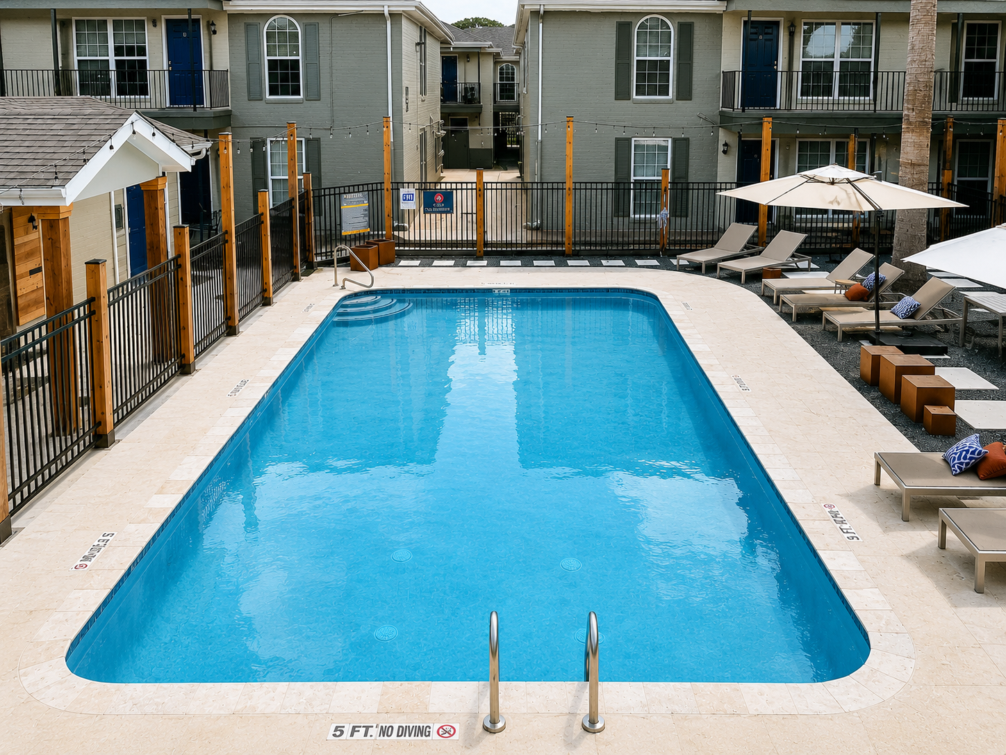 Carvel Apartments swimming pool with lounge seating