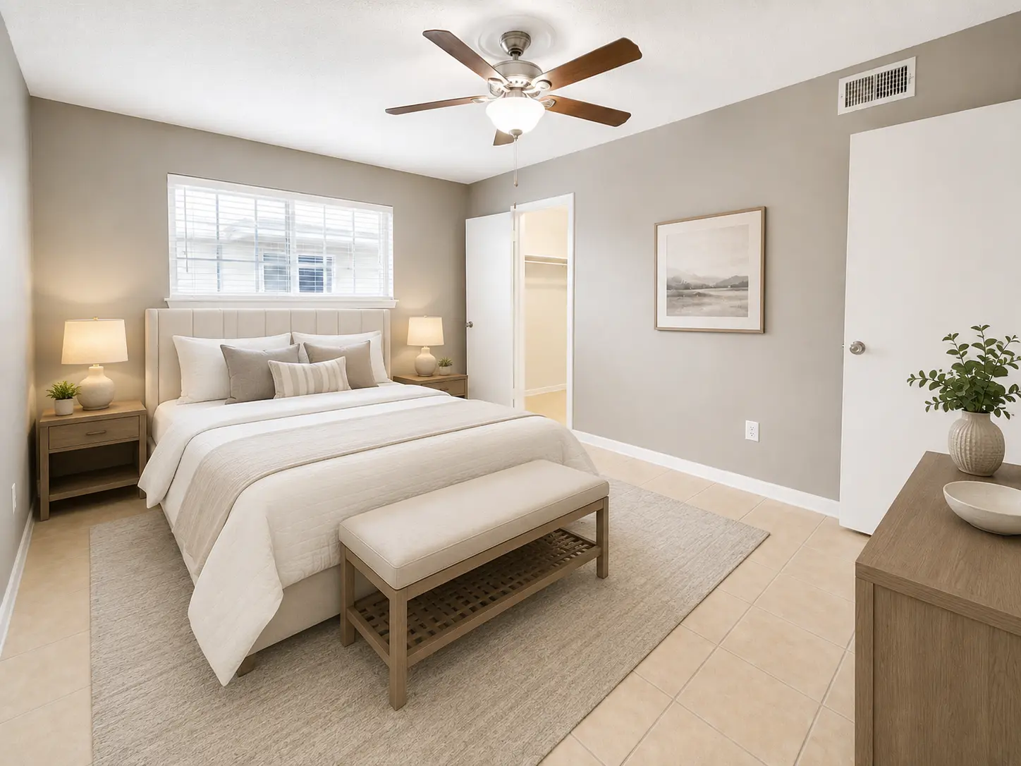 Carvel apartment bedroom with ceiling fan and walk-in closet
